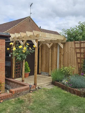 Finished timber pergola built in a garden